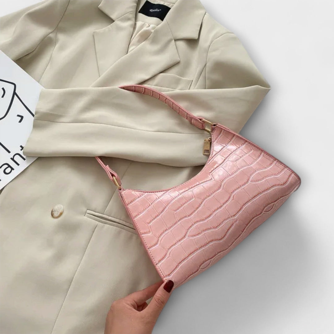 Leora. Hohtava nahkainen laukku