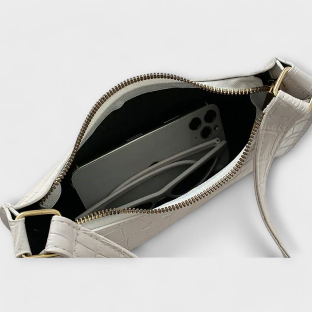 Leora. Hohtava nahkainen laukku