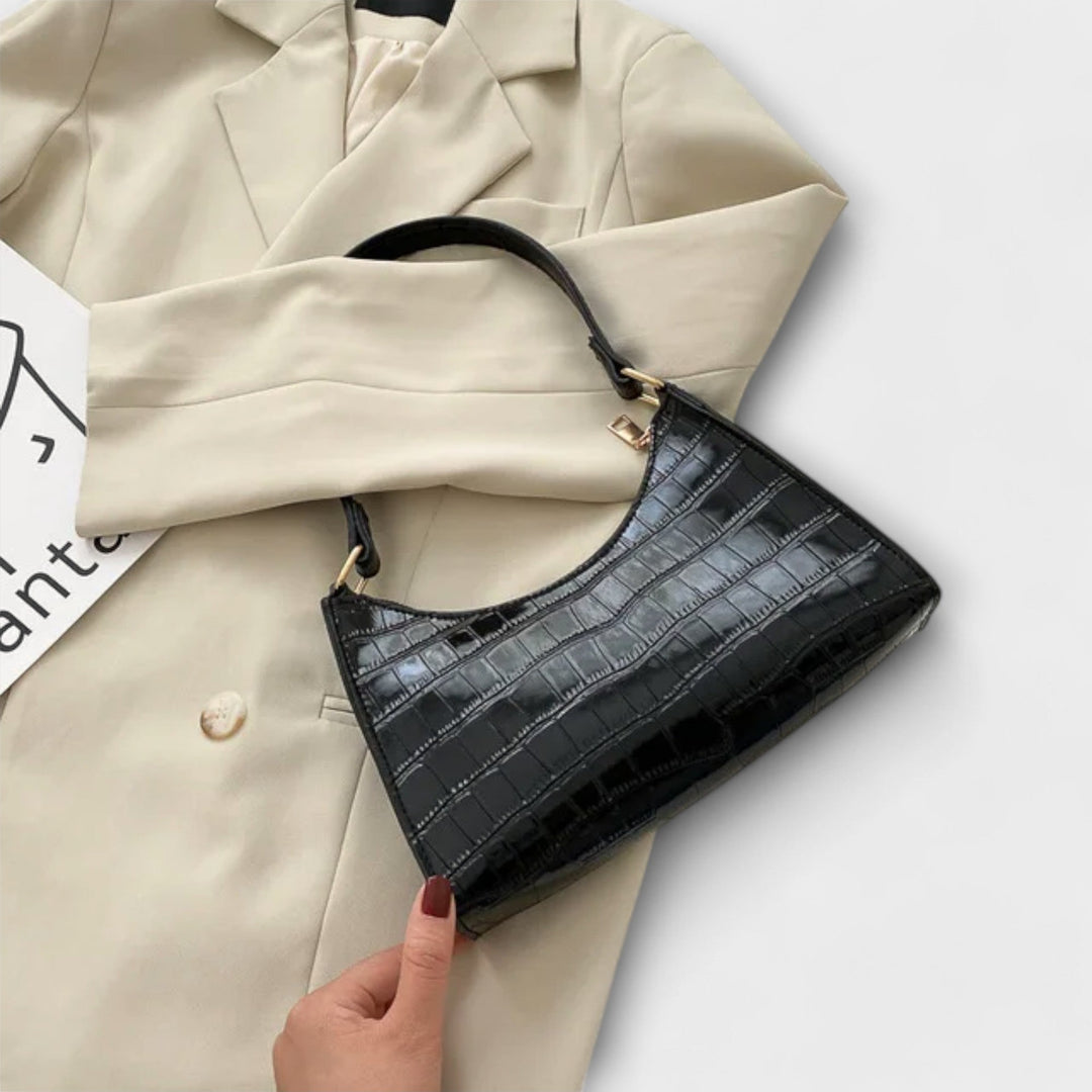 Leora. Hohtava nahkainen laukku