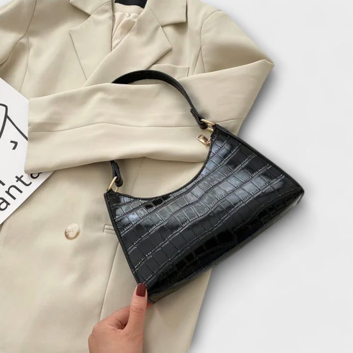 Leora. Hohtava nahkainen laukku