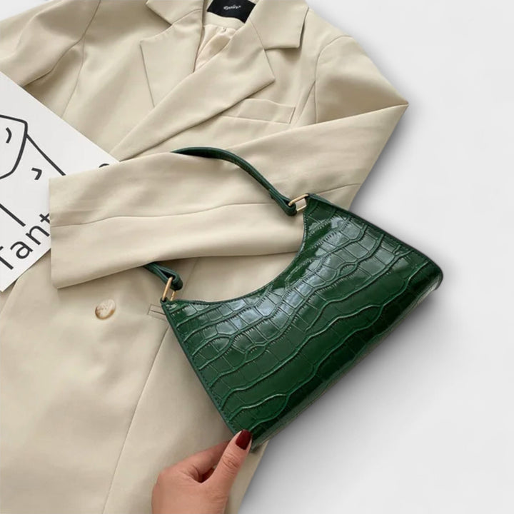 Leora. Hohtava nahkainen laukku