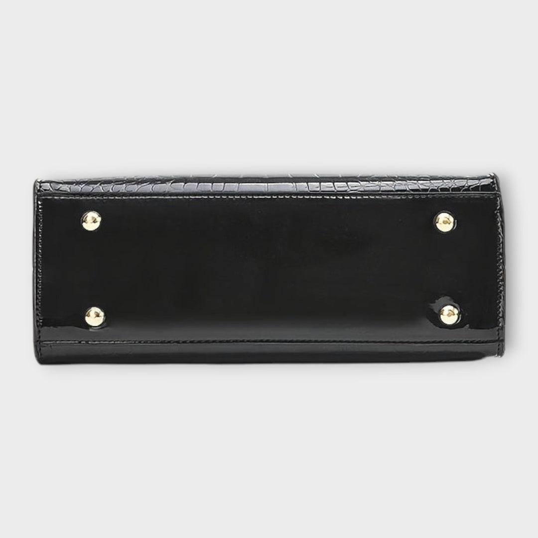 Léora - Säteilevä krokotiiliraakamustainen käsilaukku