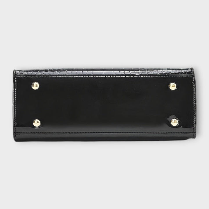 Léora - Säteilevä krokotiiliraakamustainen käsilaukku